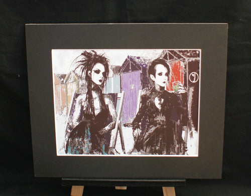 Beach Hut Goths — limited edition giclée print, two goth women by Brighton beach huts in black and violet, 255x305mm