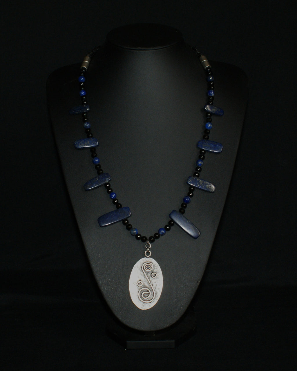 Handmade lapis lazuli and obsidian necklace with metal alloy spiral pendant