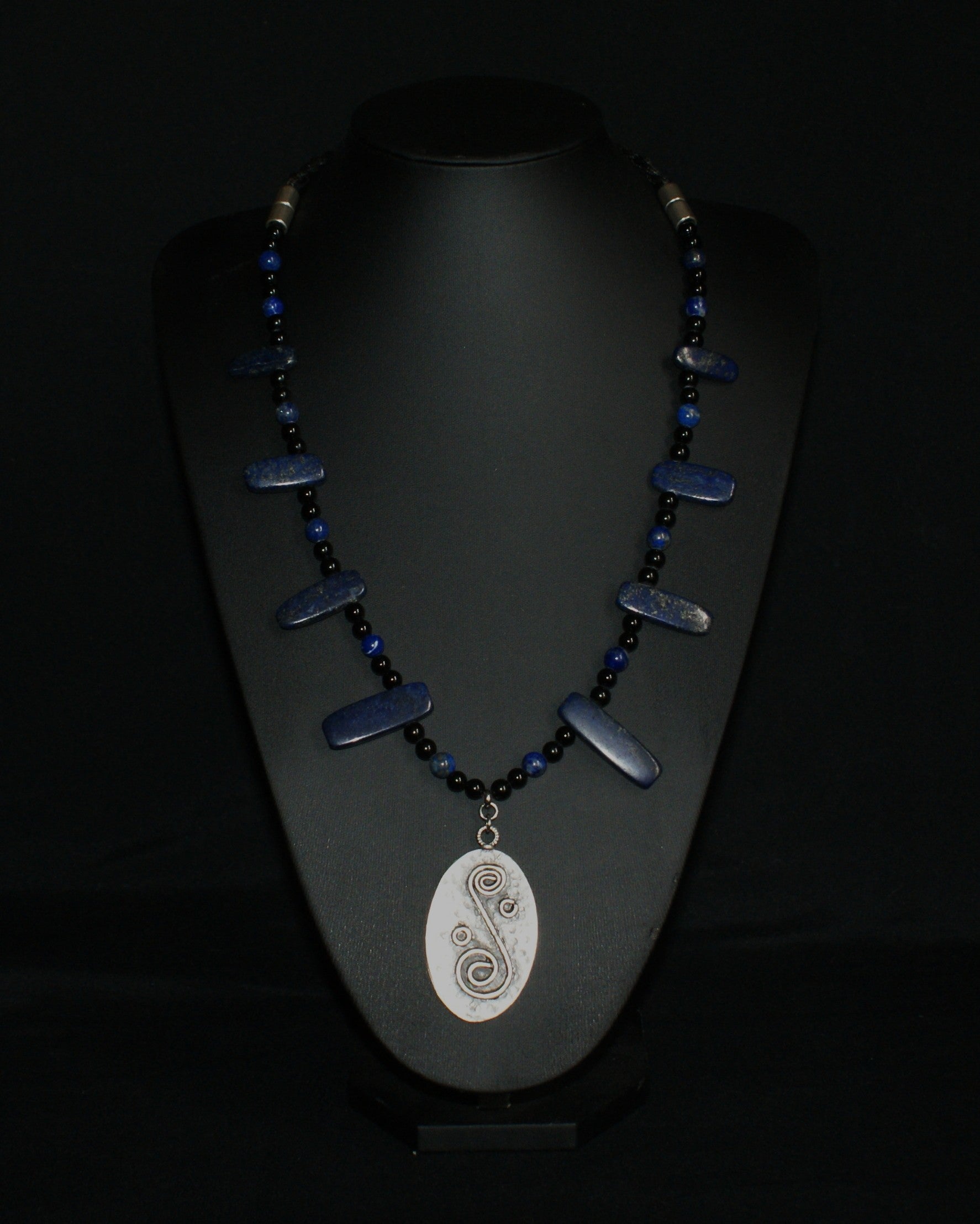 Handmade lapis lazuli and obsidian necklace with metal alloy spiral pendant